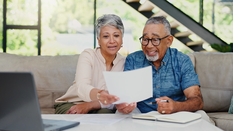 Senior couple reviewing the benefits of a home equity loan on a fixed income